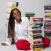 A woman amidst books.