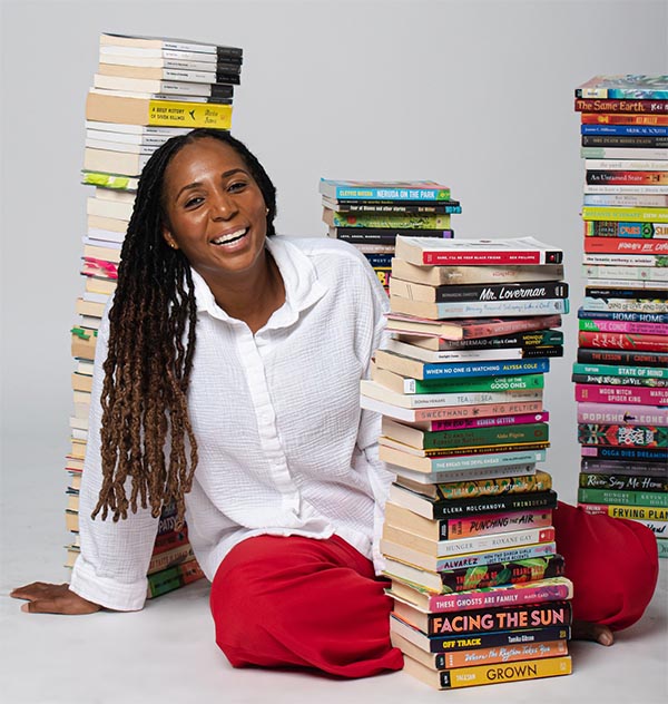 A woman amidst books.