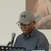 george reading at a poetry event.